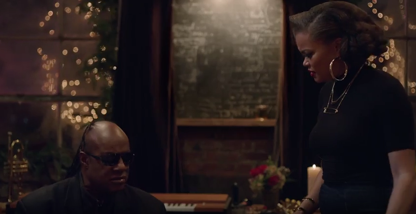 Stevie Wonder & Andra Day Perform "Someday at Christmas" in Apple Music Commercial